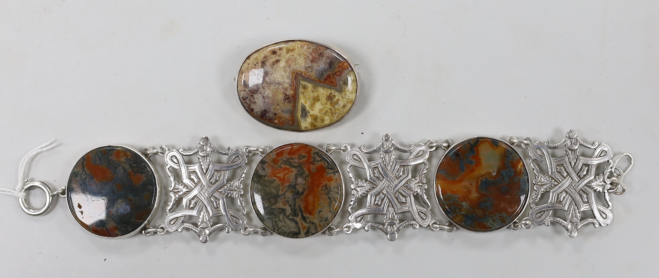 A Scottish white metal and three stone moss agate set bracelet, 19.5cm and a similar hardstone set oval brooch.